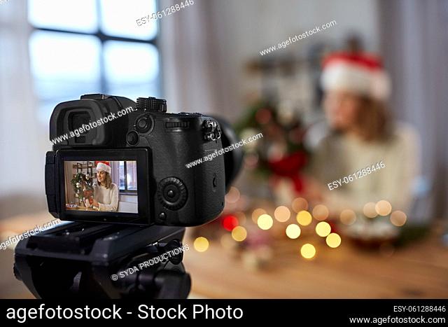 camera recording woman making christmas wreath