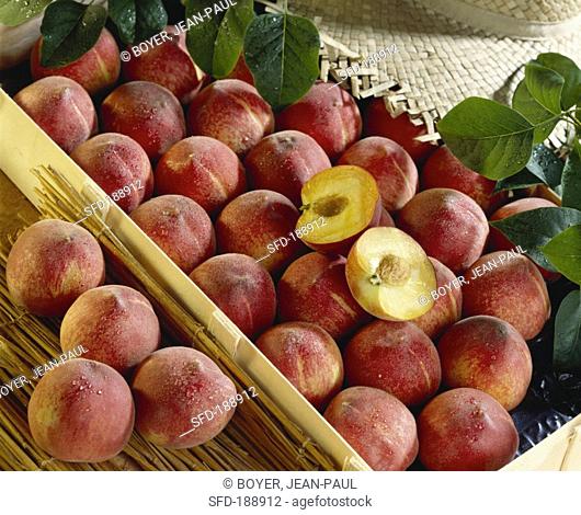 Peaches in crates, whole and halved