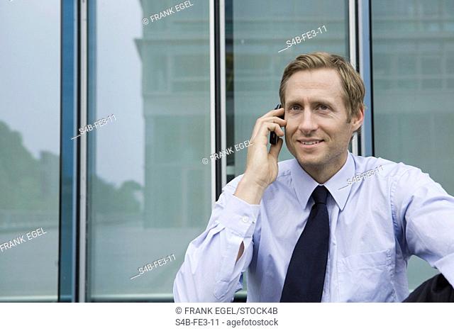 Businessman on the phone, Neumuehlen, Hamburg, Germany