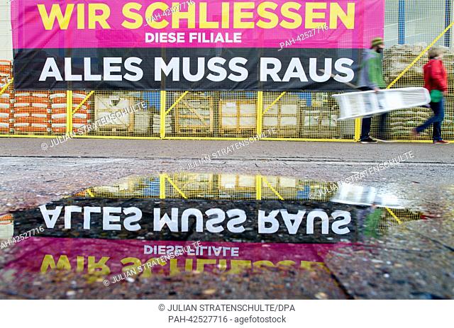 A sign reads 'We are closing this store, everything must go' outside of a Praktiker hardware store chain in Hanover, Germany, 13 September 2013