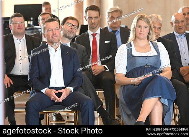 15 September 2022, Bavaria, Munich: Lothar Matthäus (l) and Natalie Geisenberger sit listening to the speech by the Bavarian Minister-President before being...