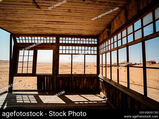 abandoned Ruins of a beautiful desert villa with view outside on a ghost town and sand