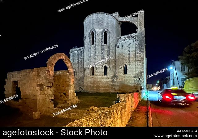 CYPRUS, FAMAGUSTA - DECEMBER 15, 2023: A view of the ruins of St George's Church (Greek Orthodox Church) at night. The Turkish Republic of Northern Cyprus is a...