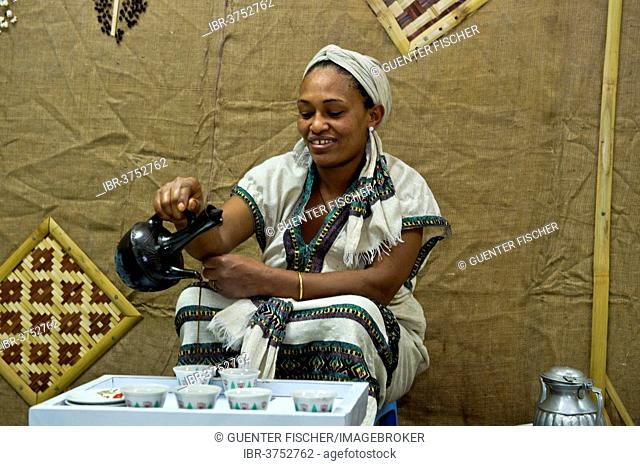 Ethiopian woman pours coffee in a traditional coffee ceremony, Addis Ababa, Oromia Region, Ethiopia