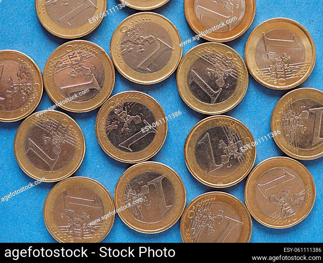Euro coins money (EUR), currency of European Union over blue background