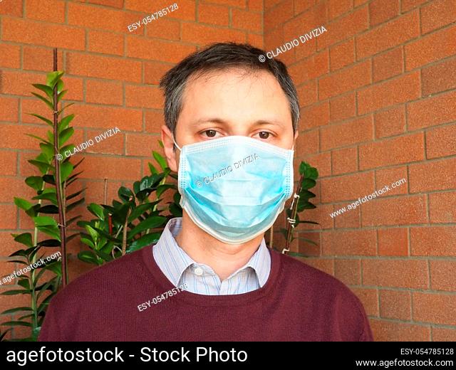 Man with surgical mask used to stop spreading Covid-19 infection