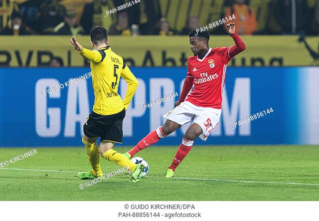 Dortmund's Marc Bartra (l) and Benfica's Nelson in action during the Champions League knock-out round of 16 match between Borussia Dortmund and S L Benfica in...