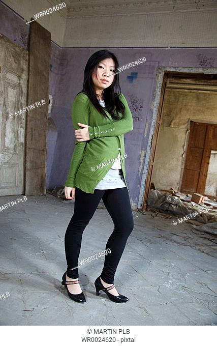 Asian girl posing in green vest