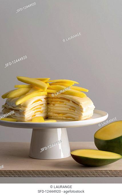 Mille Crepes cake (pancake cake) with cream and mango