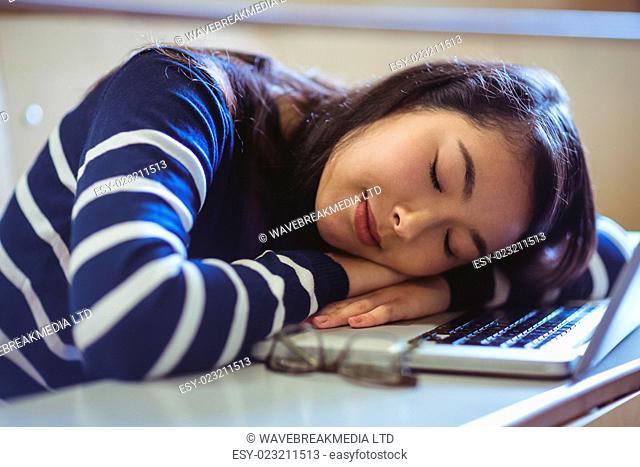 Sleeping student in lecture hall at the university