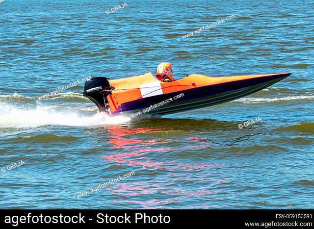 Powerboat in fast action race on the lake