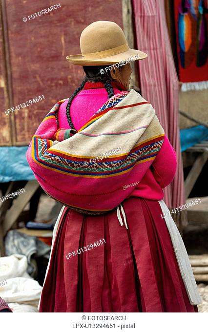 Woman shopping in a market, Pisac, Sacred Valley, Cusco Region, Peru