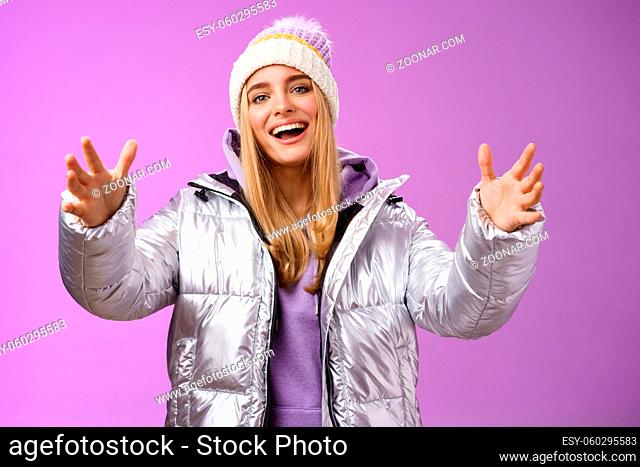 Charming carefree gorgeous blond european girl holding big thing explaining shape box extend arms reaching camera wanna hold friend tight cuddle embrace smiling...