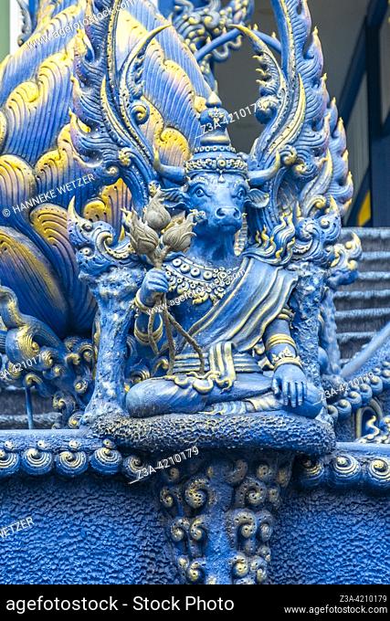 Holy cow statue at the Blue Temple (Wat Rong Suea Ten or Temple of the Dancing Tiger) in Chiang Rai, Thailand, Asia. Blue is symbolically associated with purity