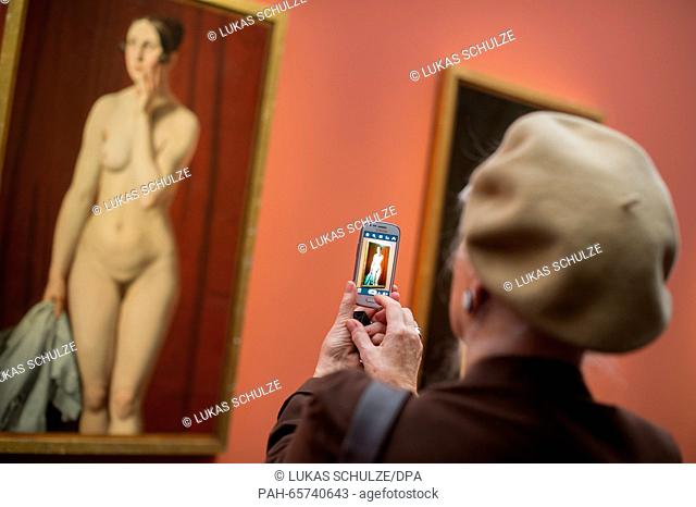 A woman photographs a painting by Danish artist Christoffer Wilhelm Eckersberg in the exhibition 'Eckersberg - Fascination with Reality' in the Kunsthalle in...