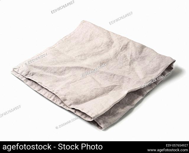 Side view on folded gray linen napkin isolated on white background. light gray linen napkin. Isolated on white with clipping path