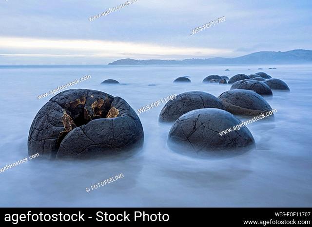 New Zealand, Oceania, South Island, Southland, Hampden, Otago, Moeraki, Koekohe Beach, Moeraki Boulders Beach, Moeraki Boulders, Round stones on beach