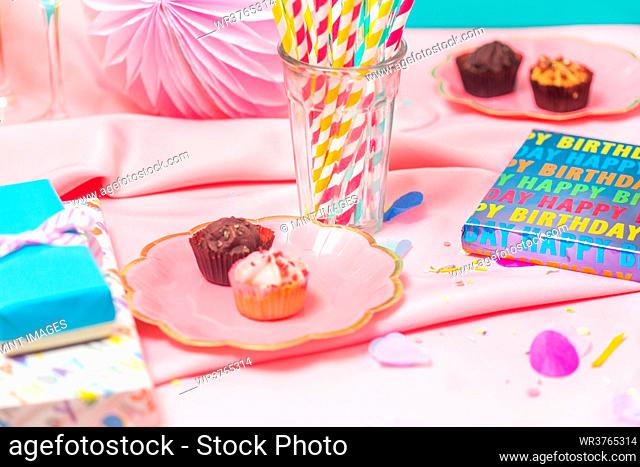 Birthday party table, with pink tablecloth
