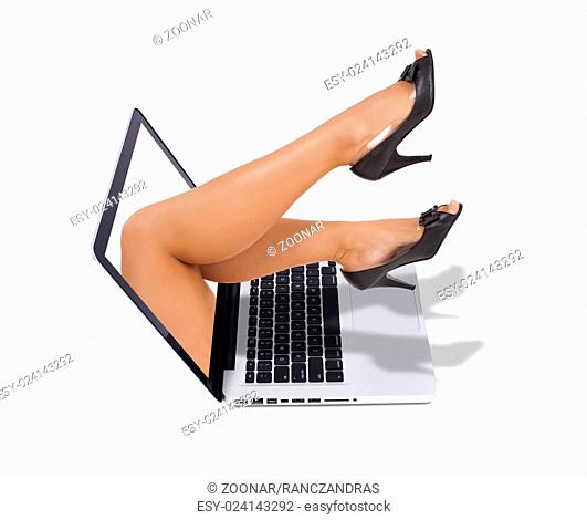 sexy legs coming out from the screen of the laptop