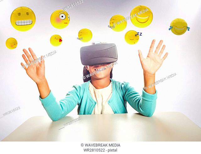 Kid in VR beneath emojis against white background