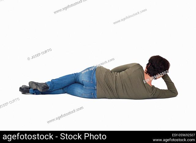 rear view of a woman lying on the floor hand on head on white background
