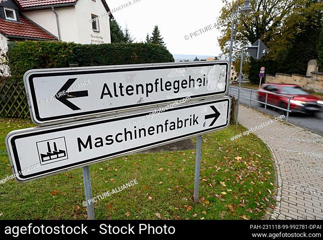 17 November 2023, Saxony, Stolpen: The signs ""Altenpflegeheim"" and ""Maschinenfabrik"" are on a road in the district of Sächsische Schweiz-Osterzgebirge