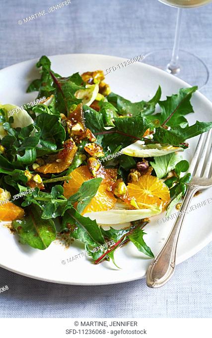 A Salad of Dandelion Greens, Pistachio Brittle, Mandarin Oranges and Endive