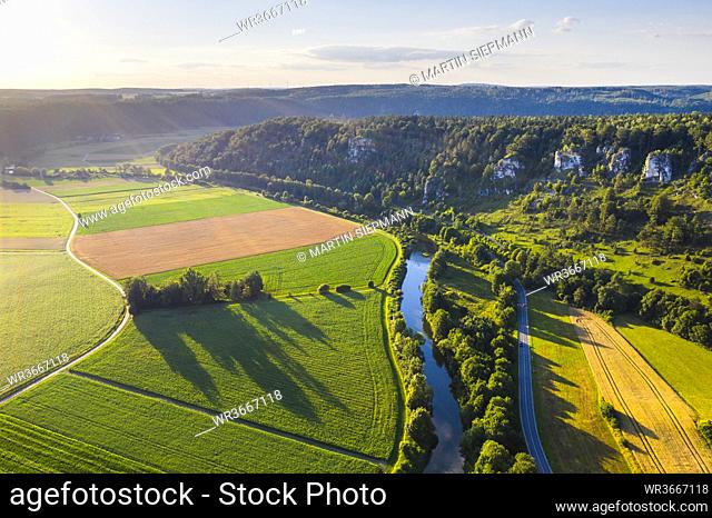 Germany, Bavaria, Kipfenberg, Drone view of river Altmuhl and Arnsberger Leite formation at springtime sunset