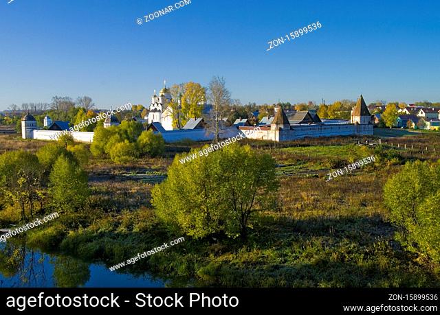 Look at the Pokrovsky Monastery (founded in 1364) from the walls of the Efimov Savior monastery across the river Kamenka, Autumn. Suzdal, Russia