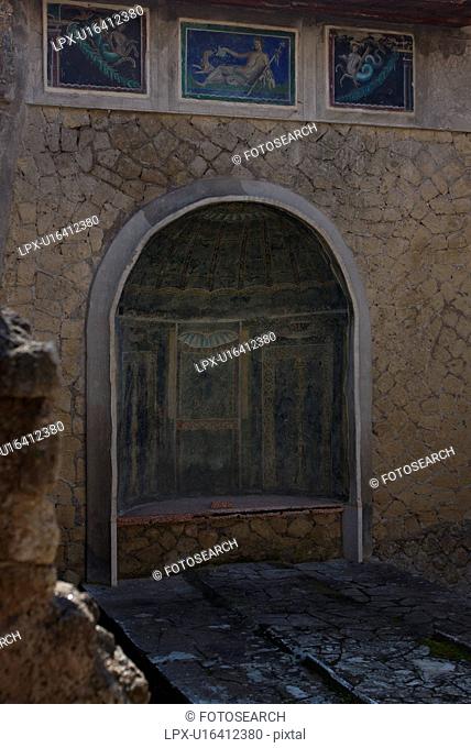 In the shadow of Vesuvius, the ruins of Ercolano - house detail of mosaic covered lararium