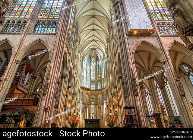 COLOGNE, GERMANY - SEP 17, 2015: Interior of the Cologne Cathedral. Roman Catholic cathedral in gothic style. Nave, ceiling, organ, columns and stained glass