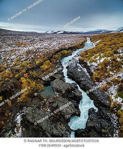 Aerial of autumn color by Hraunfossar waterfalls, Iceland