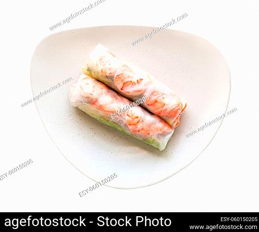 top view of Nem cuon (fresh Vietnamese nem roll with shrimps, and vegetables) on white plate isolated on white background