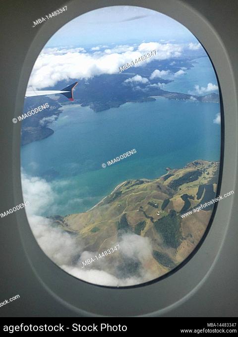 Looking out from an airplane window to the landscape of New Zealand's North Island