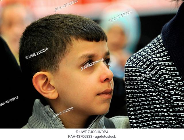 A Syrian refugee child looks around after the arrival at the airport Kassel-Calden, Germany, 30 October 2013. According to the regional authority of Hesse in...