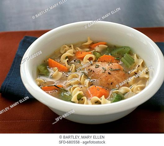 Bowl of Chicken Noodle Soup with Carrots and Celery