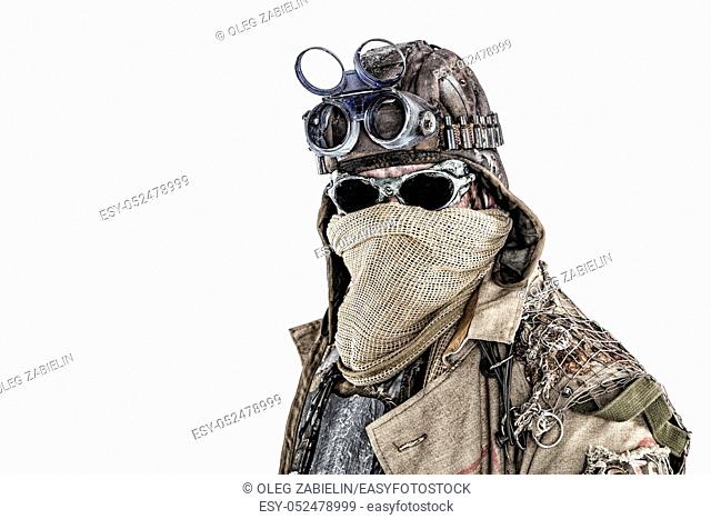 Close up portrait of nuclear doomsday survivor, post apocalyptic world marauder with face hidden behind sackcloth mask and sunglasses