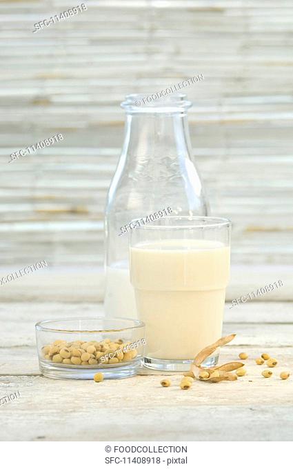 Soya milk in a glass and a bottle