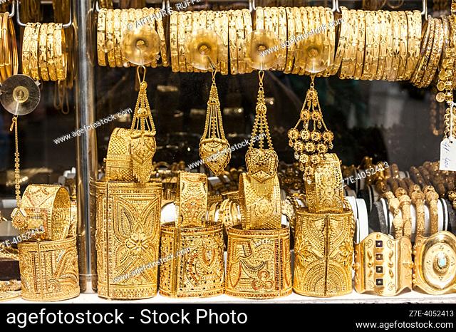 Deira Gold Souq. Detail of jewelry in shop window. Dubai, United Arab Emirates, Middle East