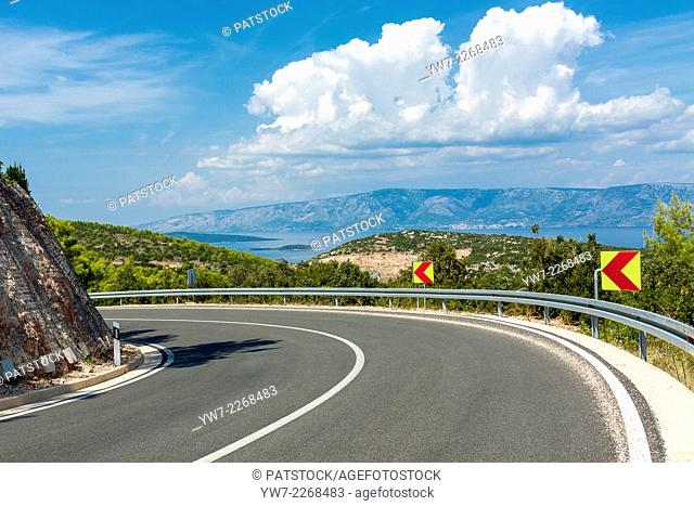 Asphalt road near Humac village leading towards Jelsa and Hvar, Hvar island, Croatia