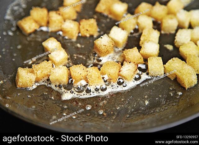 Croutons being fried