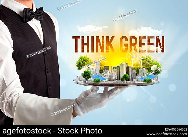 Waiter serving eco city with THINK GREEN inscription, renewabke energy concept