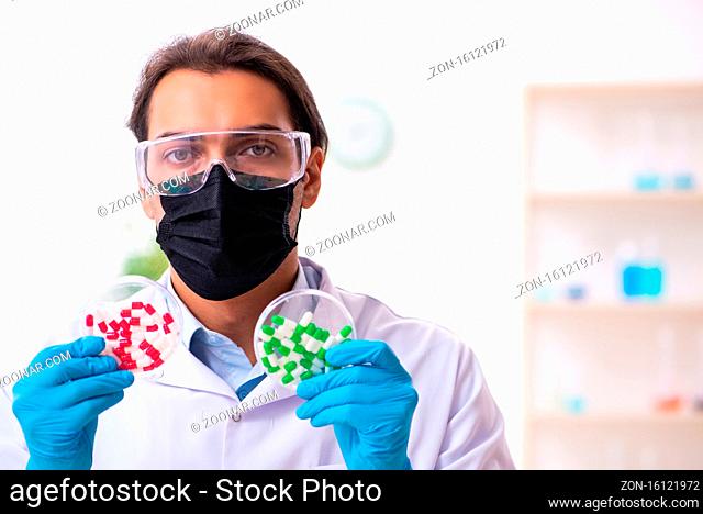 Young chemist in drug synthesis concept