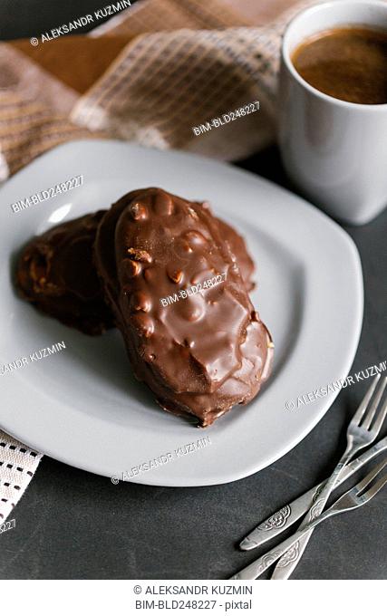 Chocolate cookies with nuts on plate