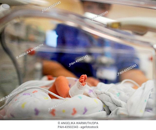 A nurse takes care of triplets in an incubator at the intensice care ward for early and newly borns of the University Hospital Hamburg-Eppendorf (UKE) in...