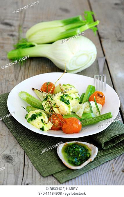 Fennel and tomatoes with chunks of cheese and basil pesto