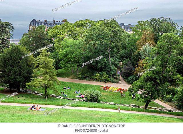 France, Paris 19th district, Parc des Buttes-Chaumont, visitors on the lawns