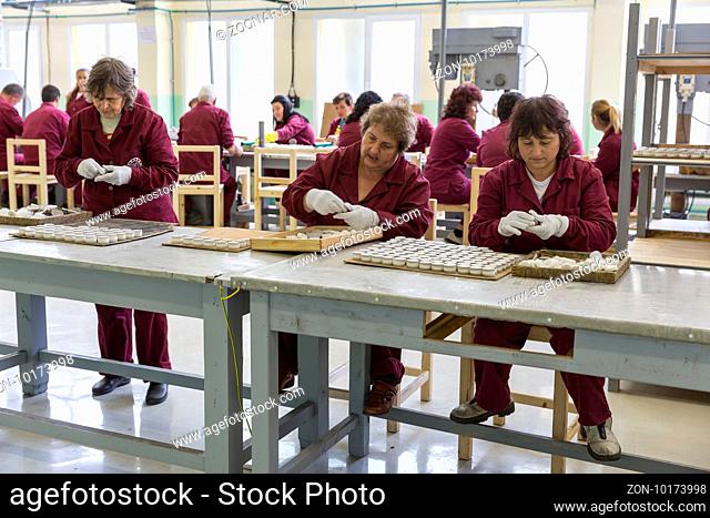 Sopot, Bulgaria - May 17, 2016: Arsenal women workers are producing weapons detonators in one of Bulgaria's arms factory