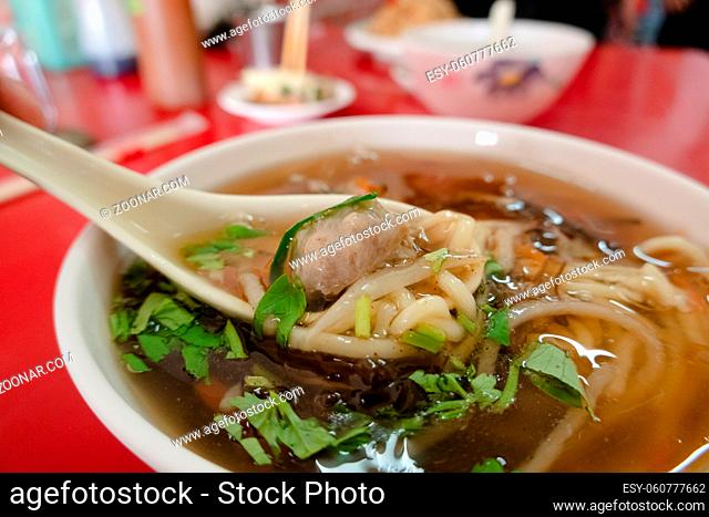 Taiwanese snacks of thickened soup noodles with starch coated pork