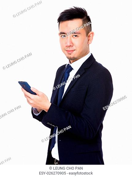 Young businessman use of the cellphone